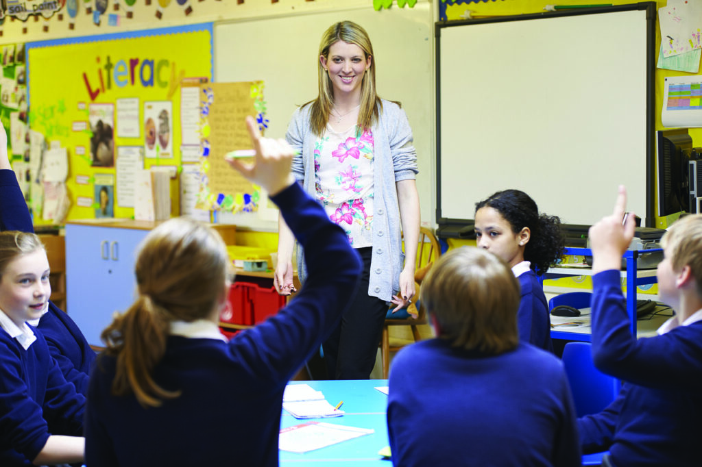 Students and teacher in class learning - Key Stage Learning - provider of online tuition and training